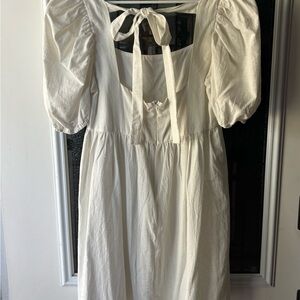 Altar'd State white mini dress with bow detail on back